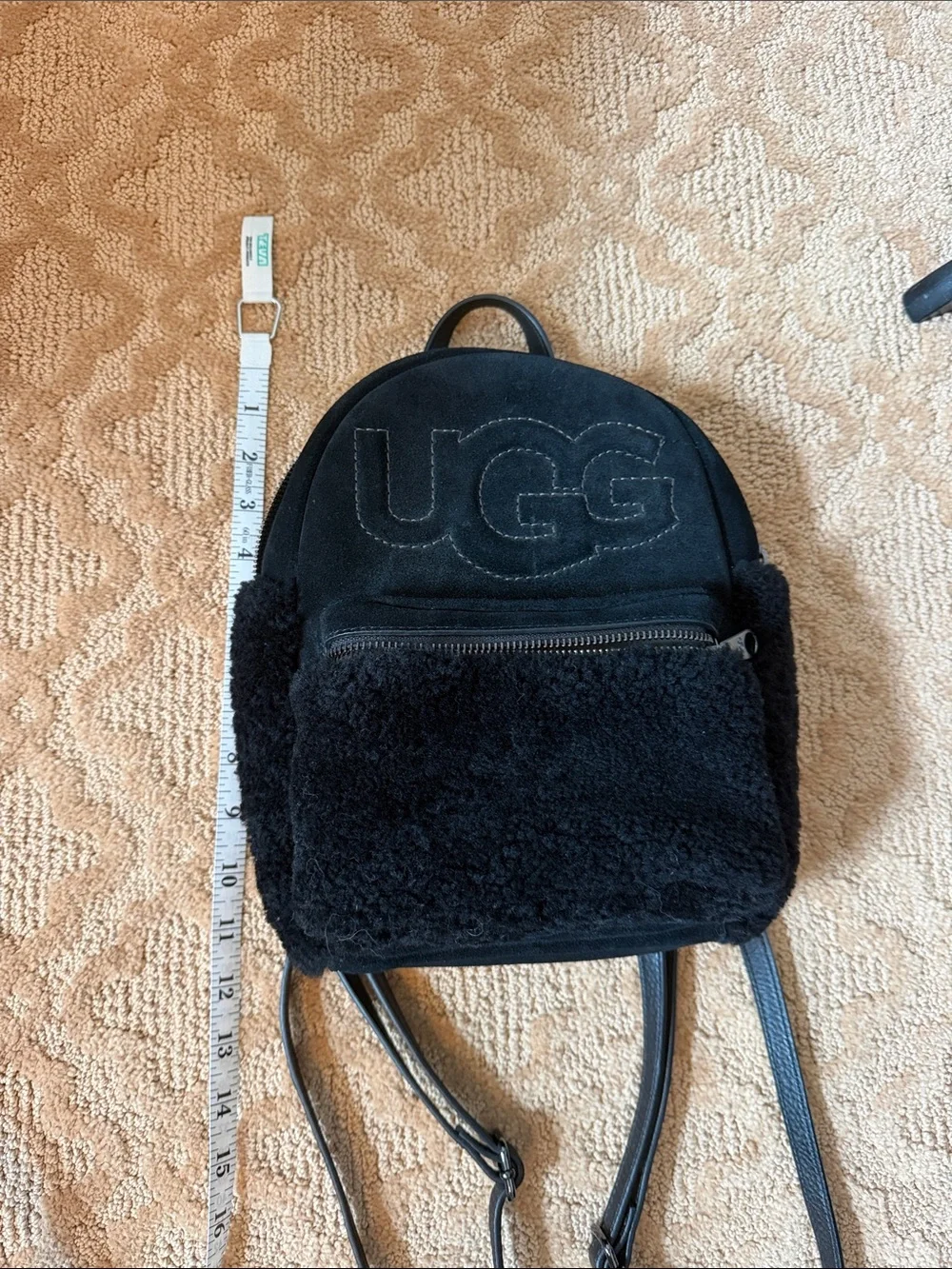 dannie mini backpack faux fur UGG II Sheepskin Women's Black This compact backpack embodies the iconic UGG style UGG Dannie II Mini Backpack
